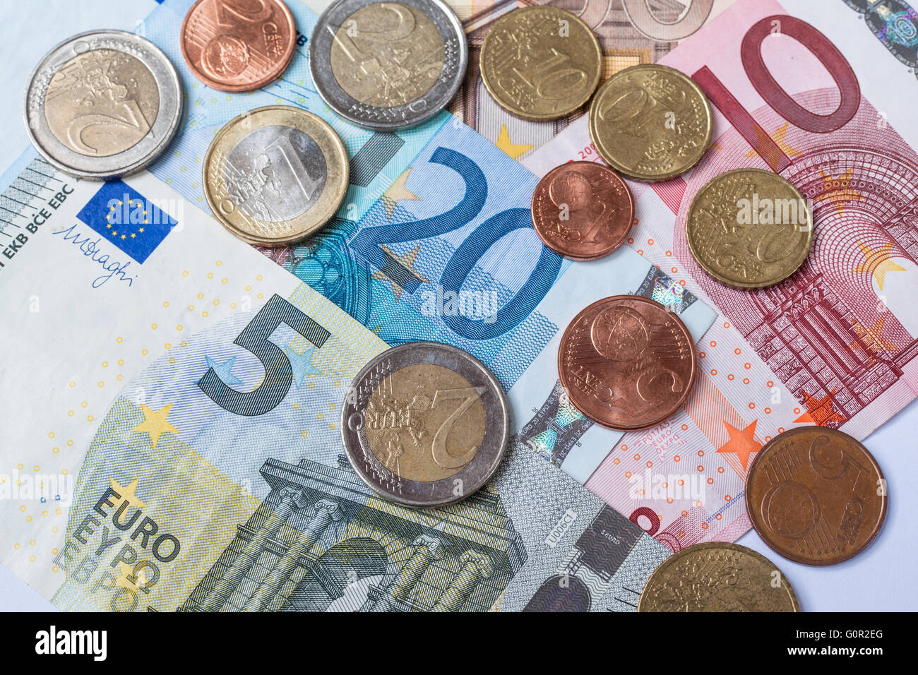 Banknotes and coins of euro currency as background Stock Photo