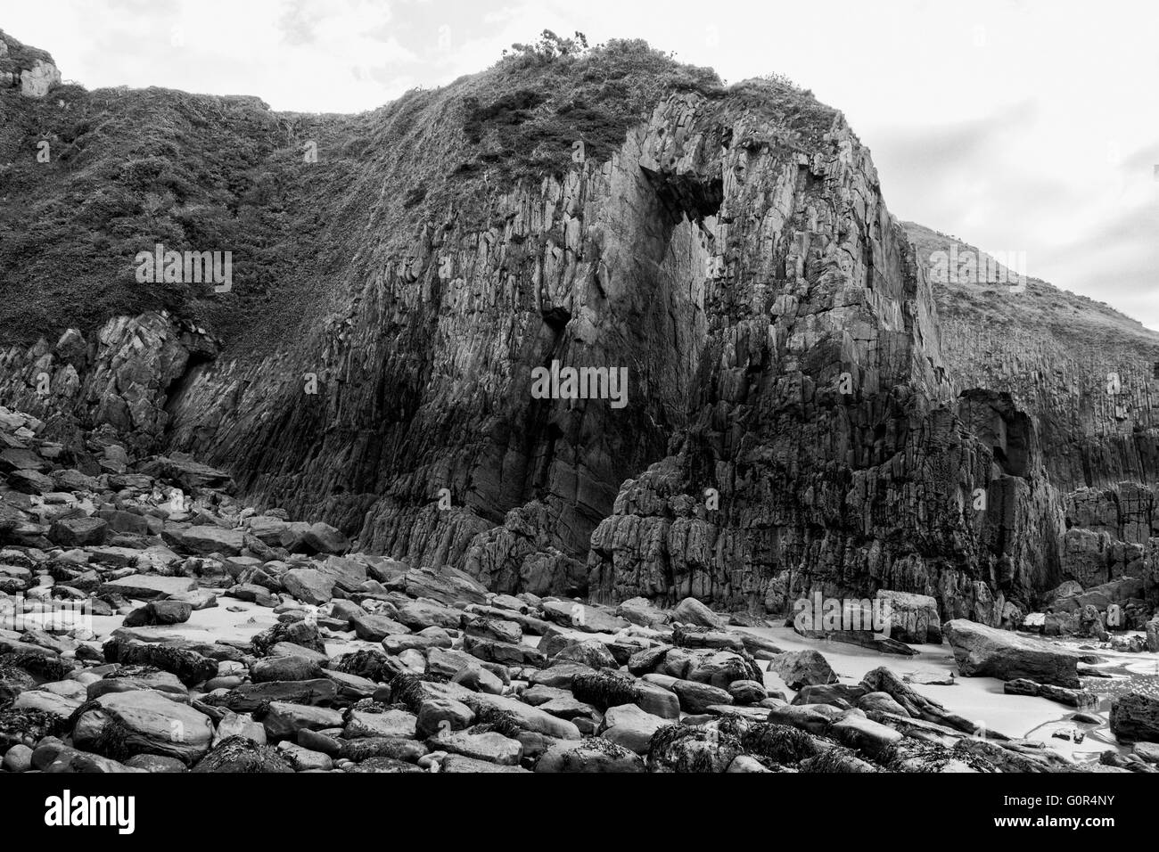 Church Doors rock formation in Skrinkle Haven cove with surf washing over the rocks, Lydstep, Pembrokeshire, Wales, , Europe Stock Photo