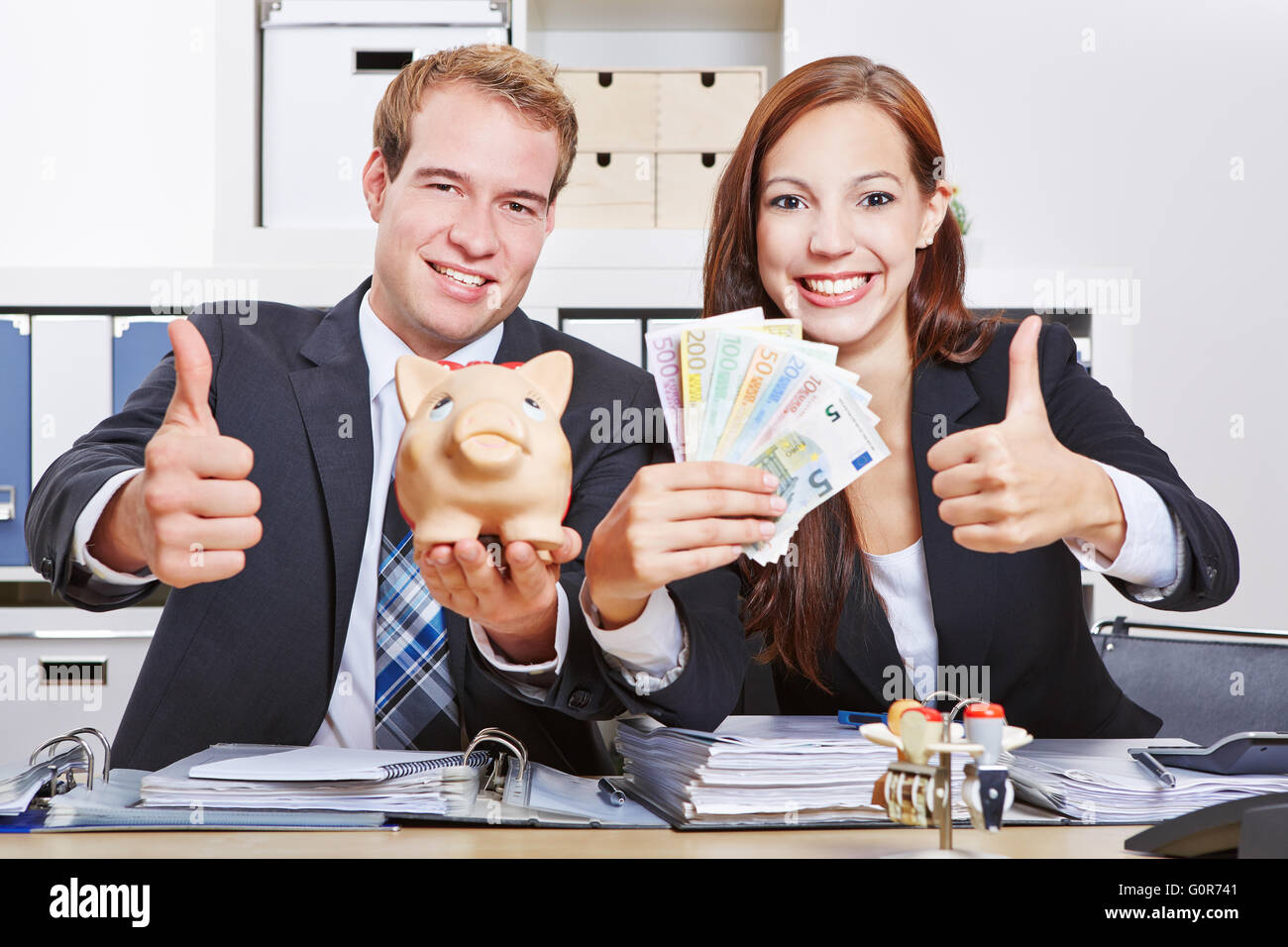 Business man holding money hi-res stock photography and images - Alamy
