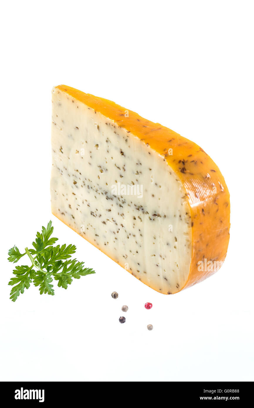 gouda with cumin in front of white background Stock Photo