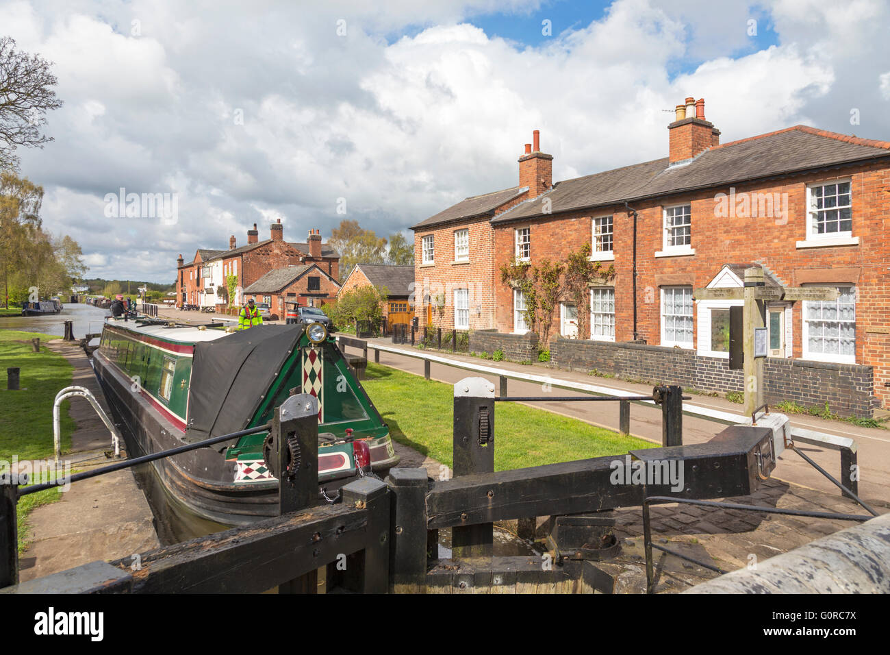 Narrowboats at Fradley Junction lock on the Trent and Mersey Canal, Staffordshire, England, UK Stock Photo
