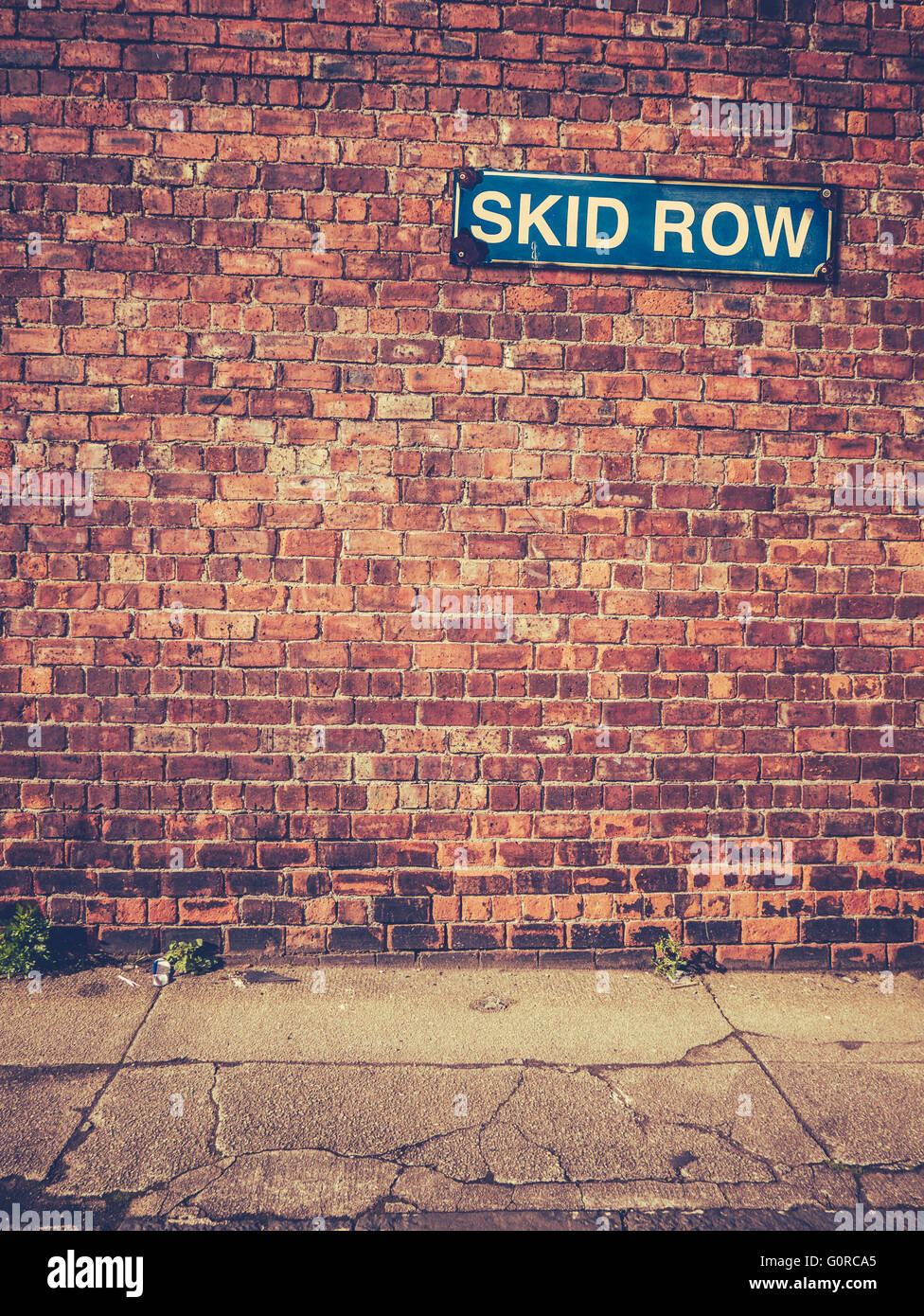 Skid Row Sign On A Red Brick Wall Stock Photo