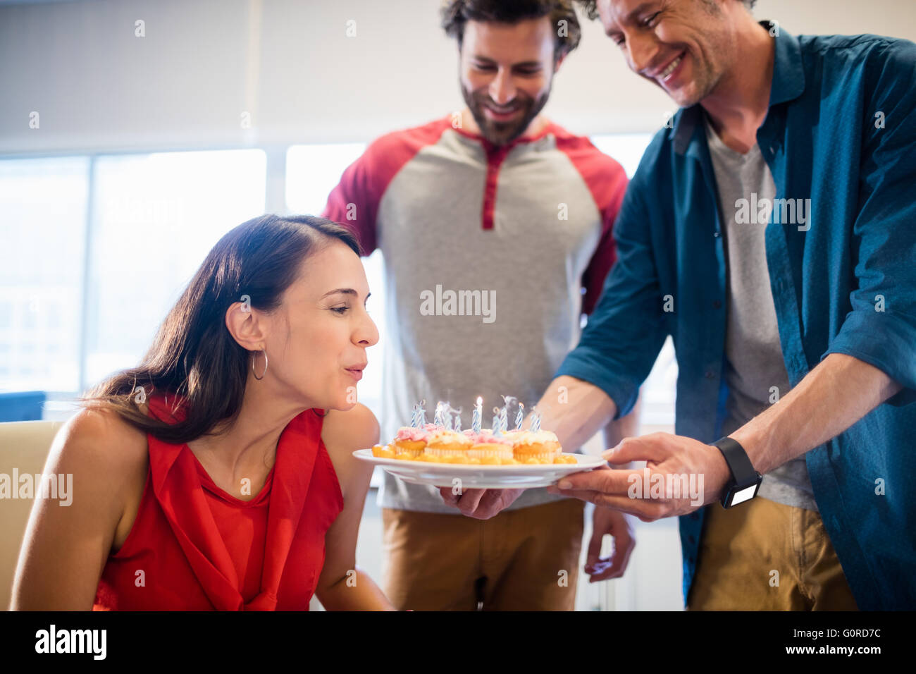 Colleagues celebrating a birthday Stock Photo - Alamy