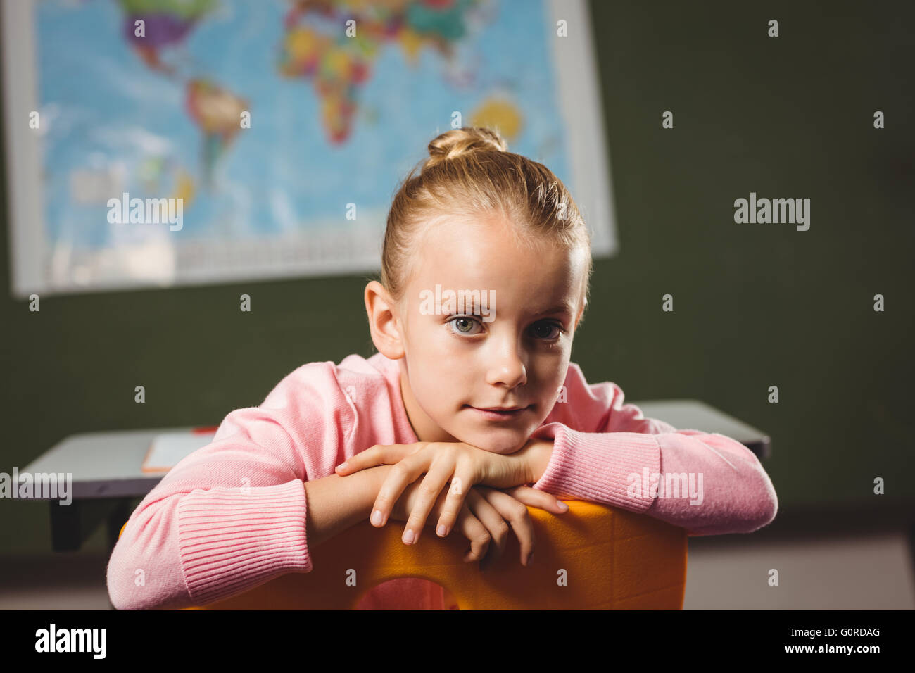 Girl leaning against chair Stock Photo Alamy