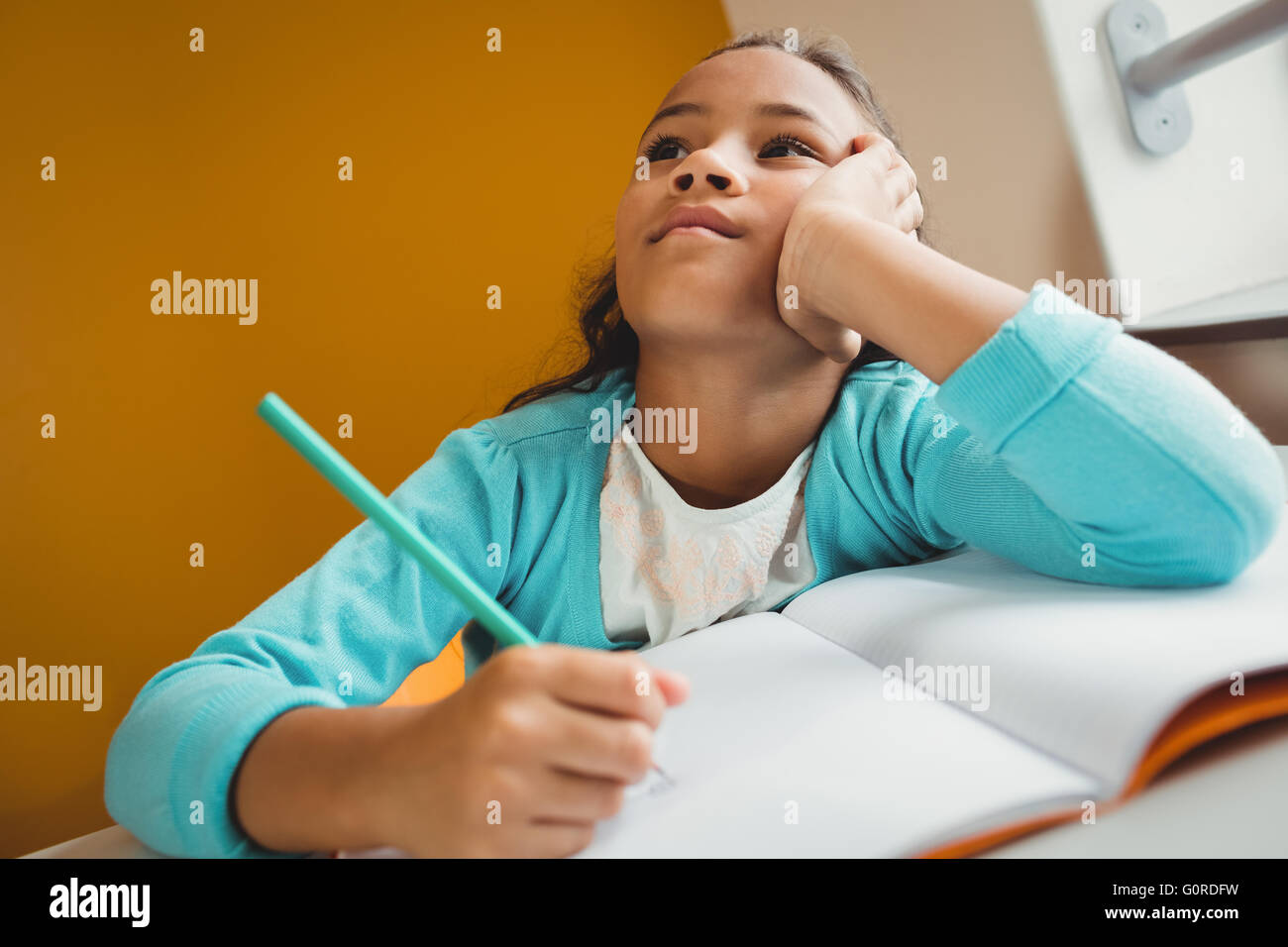 Girl writing in her notebook Stock Photo