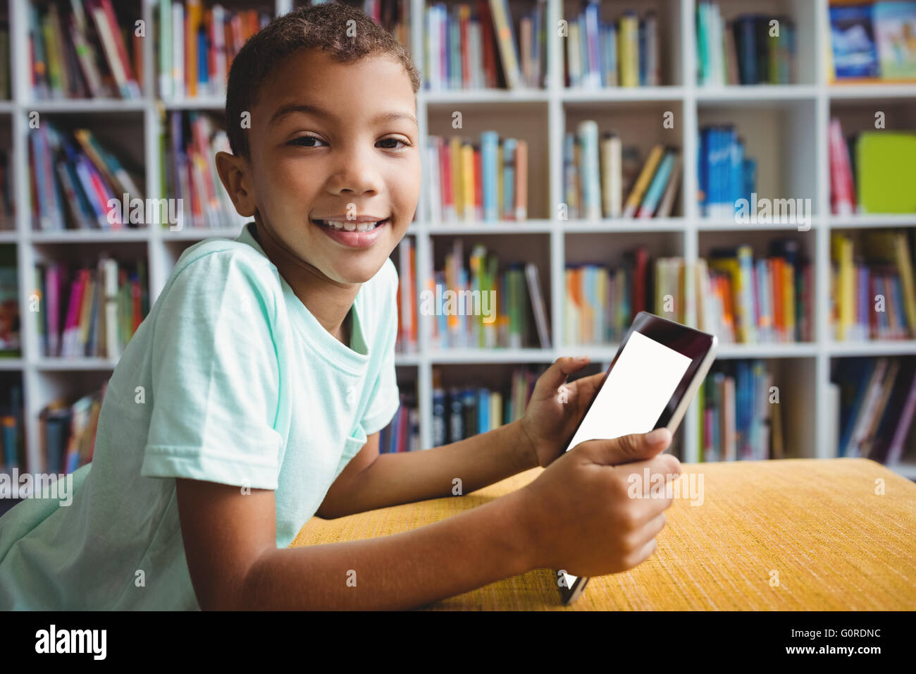 Little boy using a tablet Stock Photo - Alamy