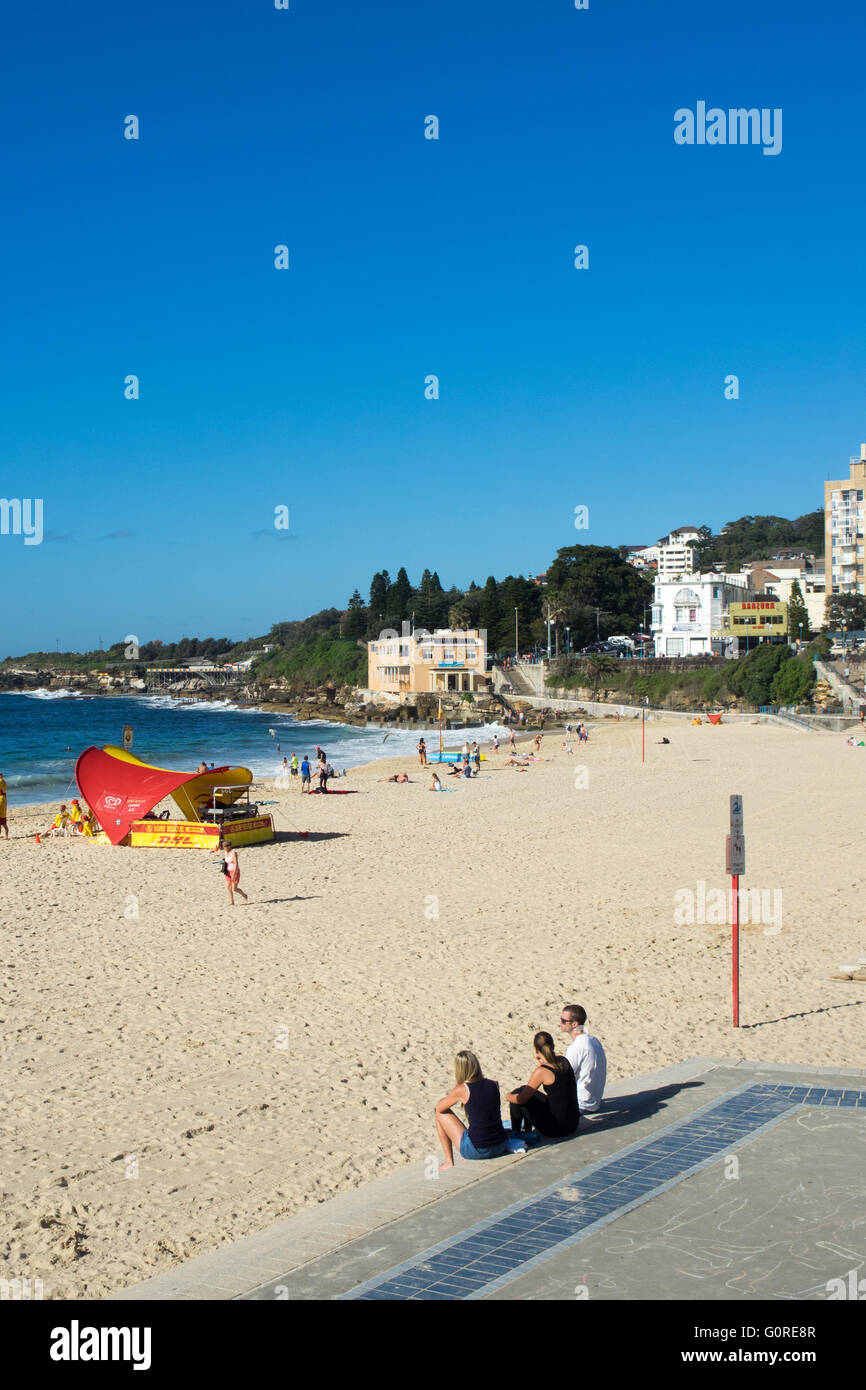 People sitting on steps to Coogee Beach, Sydney. Stock Photo
