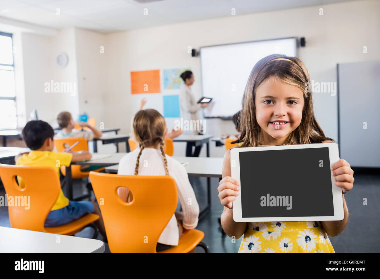 Child posing with a tablet Stock Photo