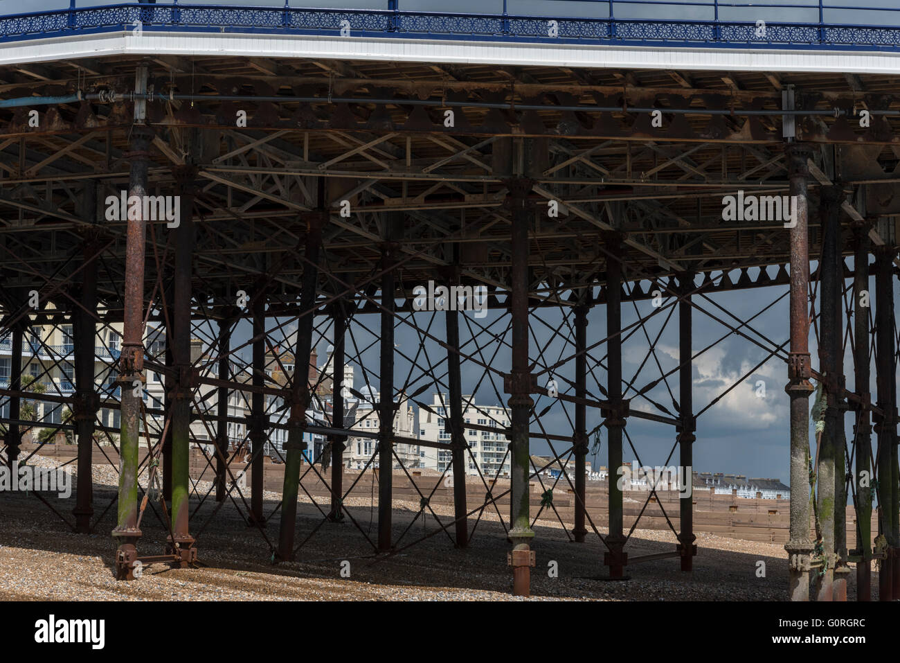 The Victorian iron struts and legs of Eastbourne Pier, a grade II* listed building Stock Photo