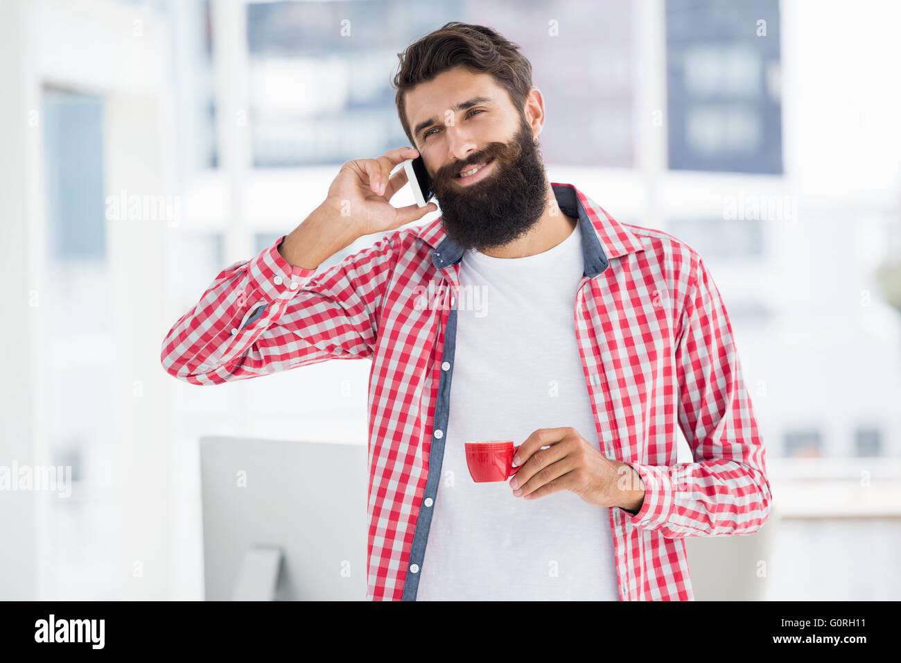 Hipster calling someone Stock Photo
