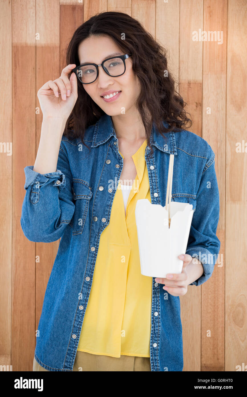 Hipster eating with chopsticks Stock Photo