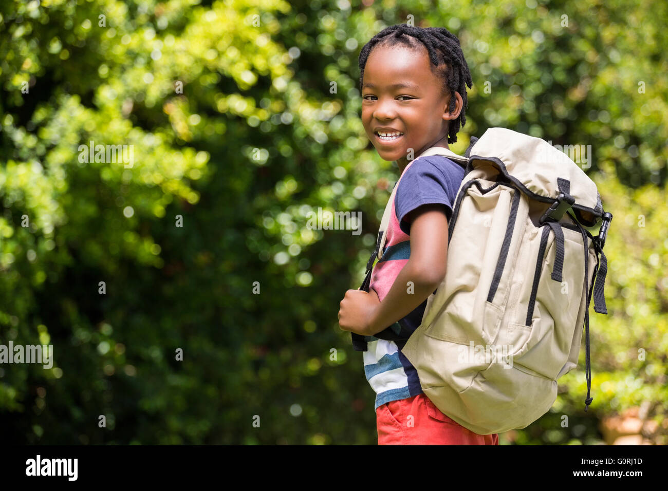 Kid holding outlet backpack