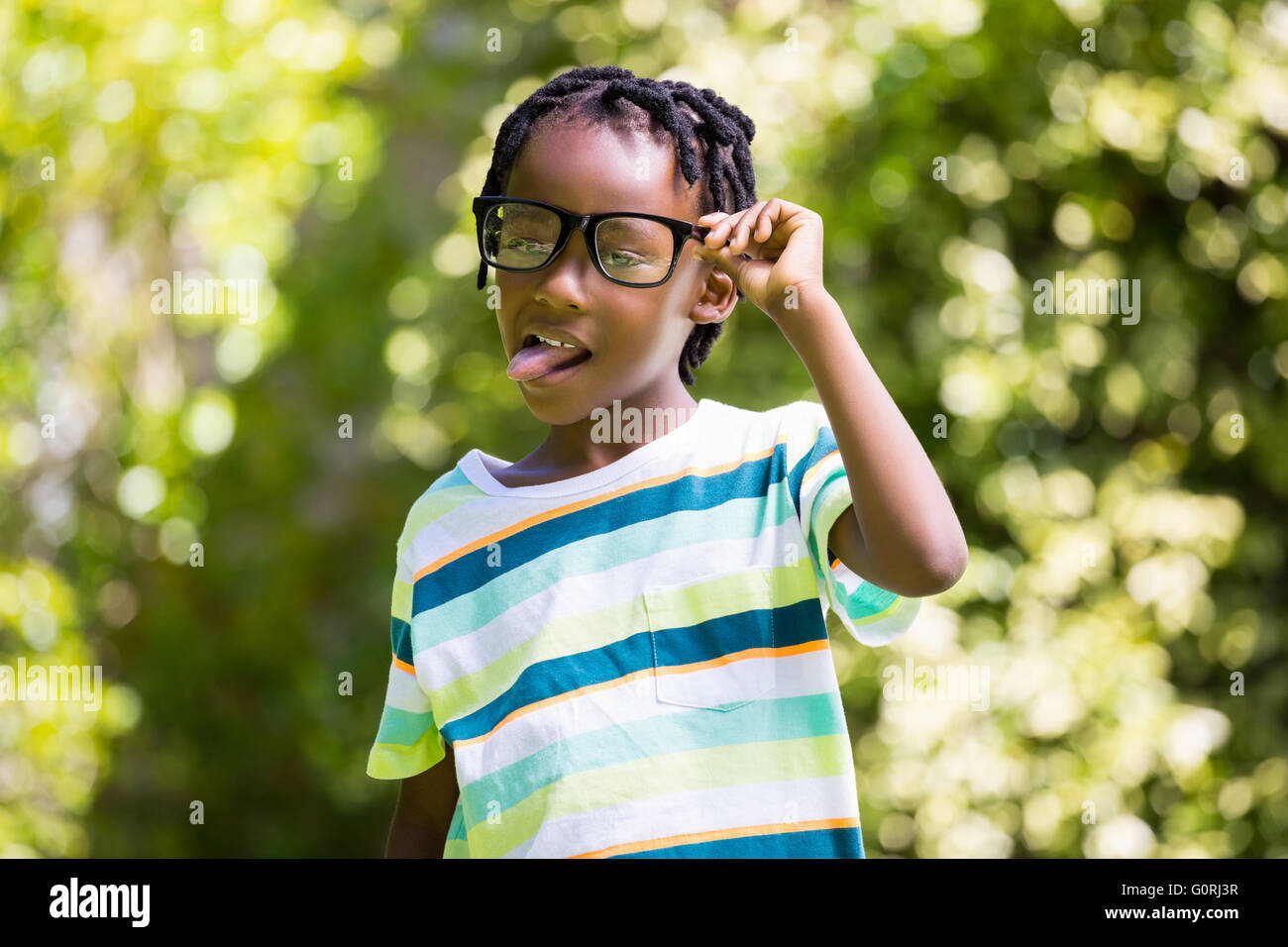 A kid sticking his tongue out Stock Photo