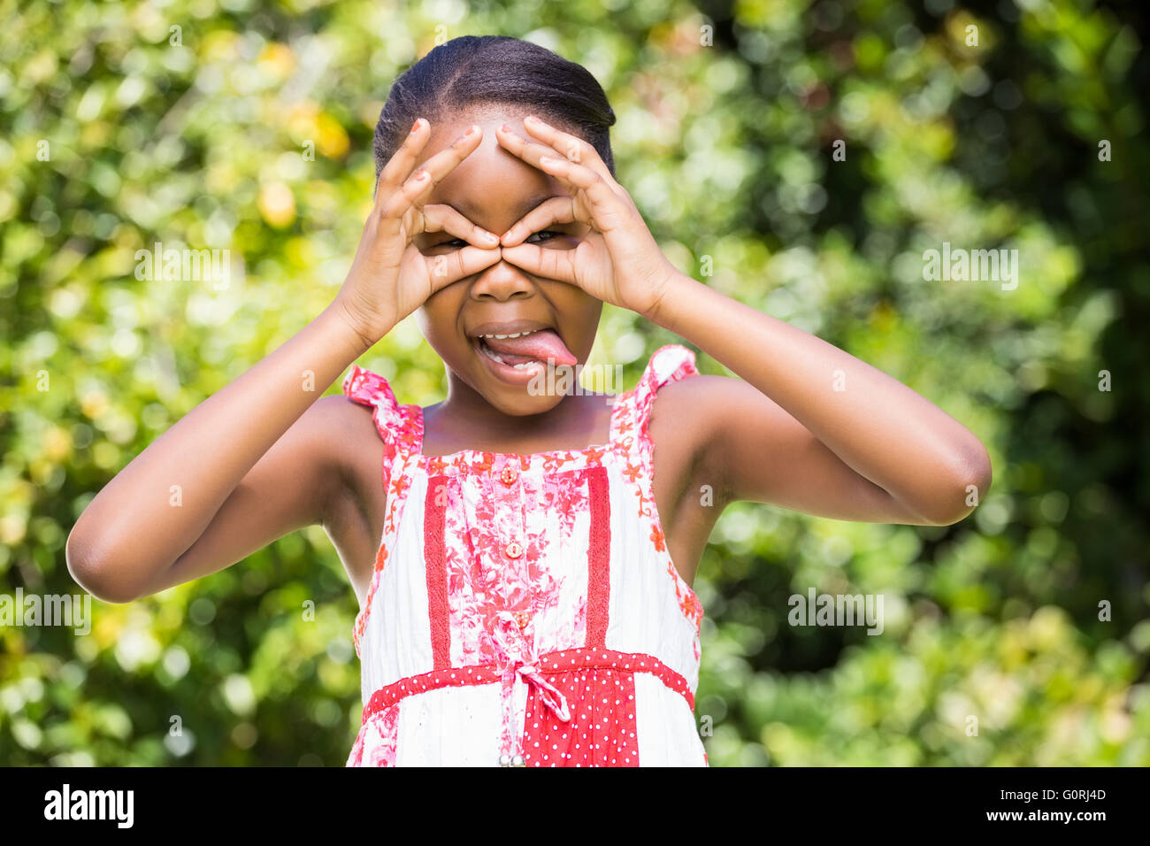A little girl making faces Stock Photo