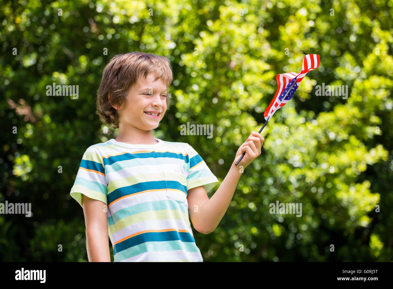 A little boy is holding an american flag Stock Photo