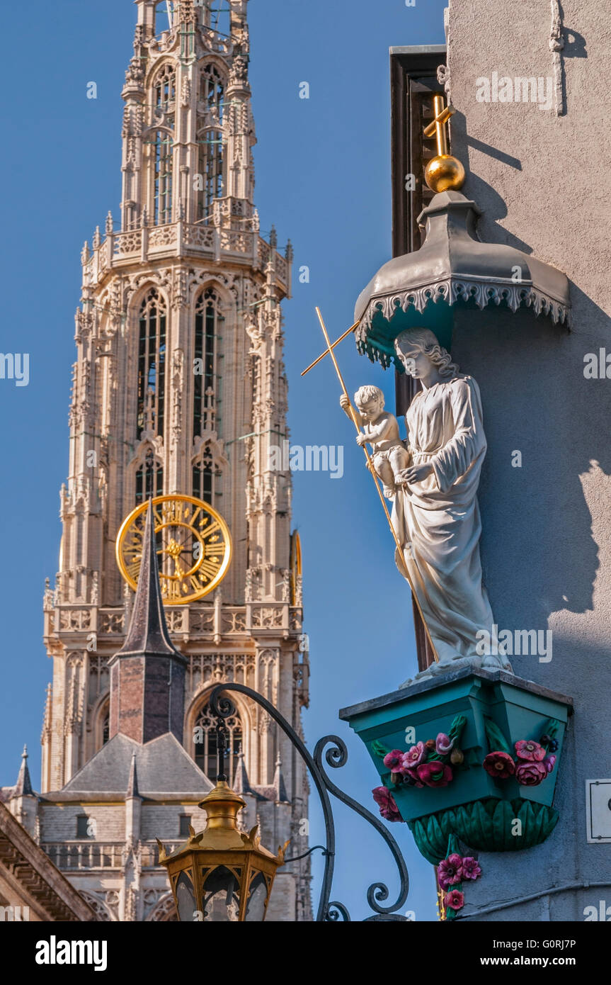 Street corner statue and cathedral spire Antwerp Belgium Stock Photo