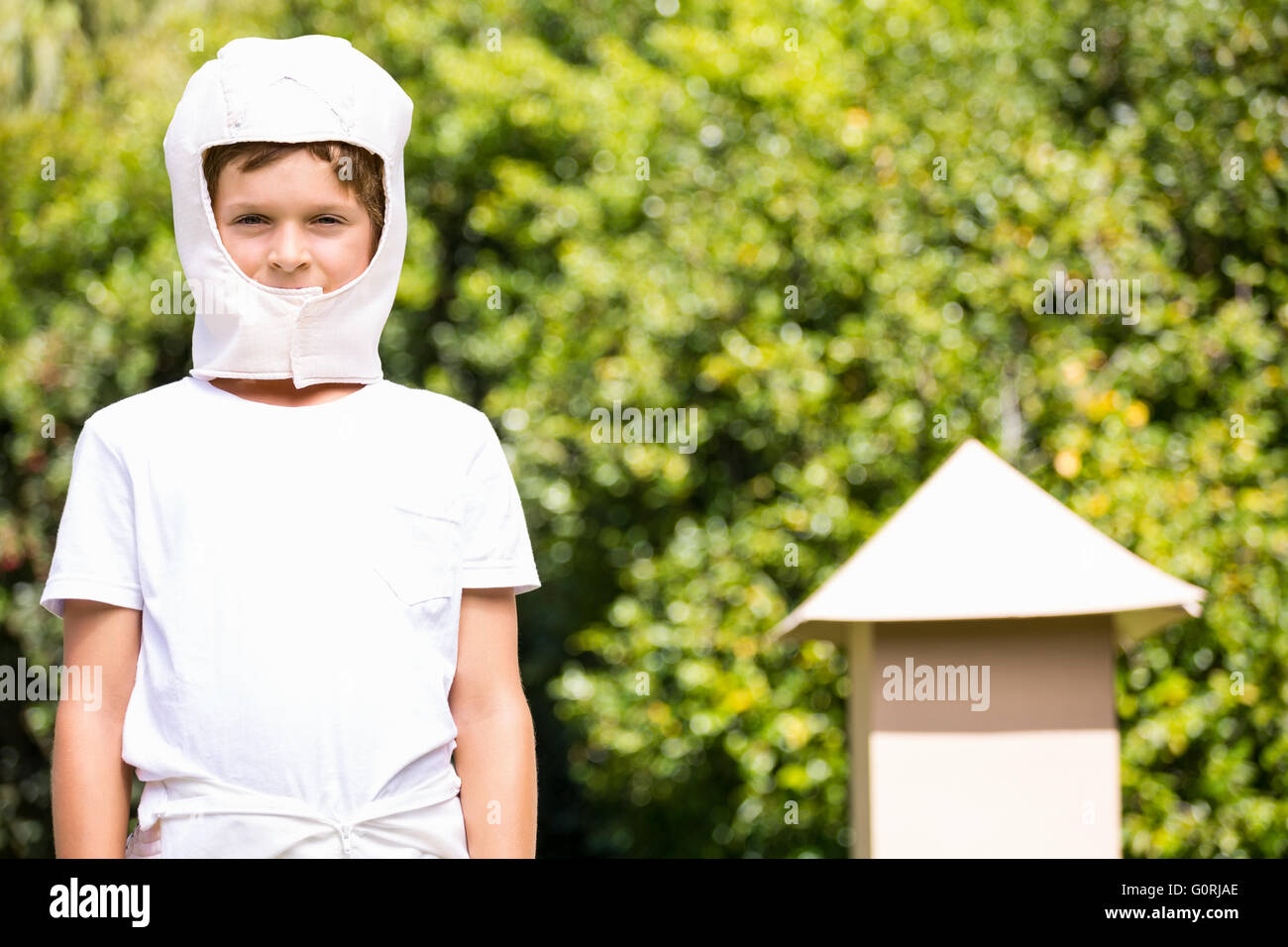 A kid with a costume is watching the lens Stock Photo
