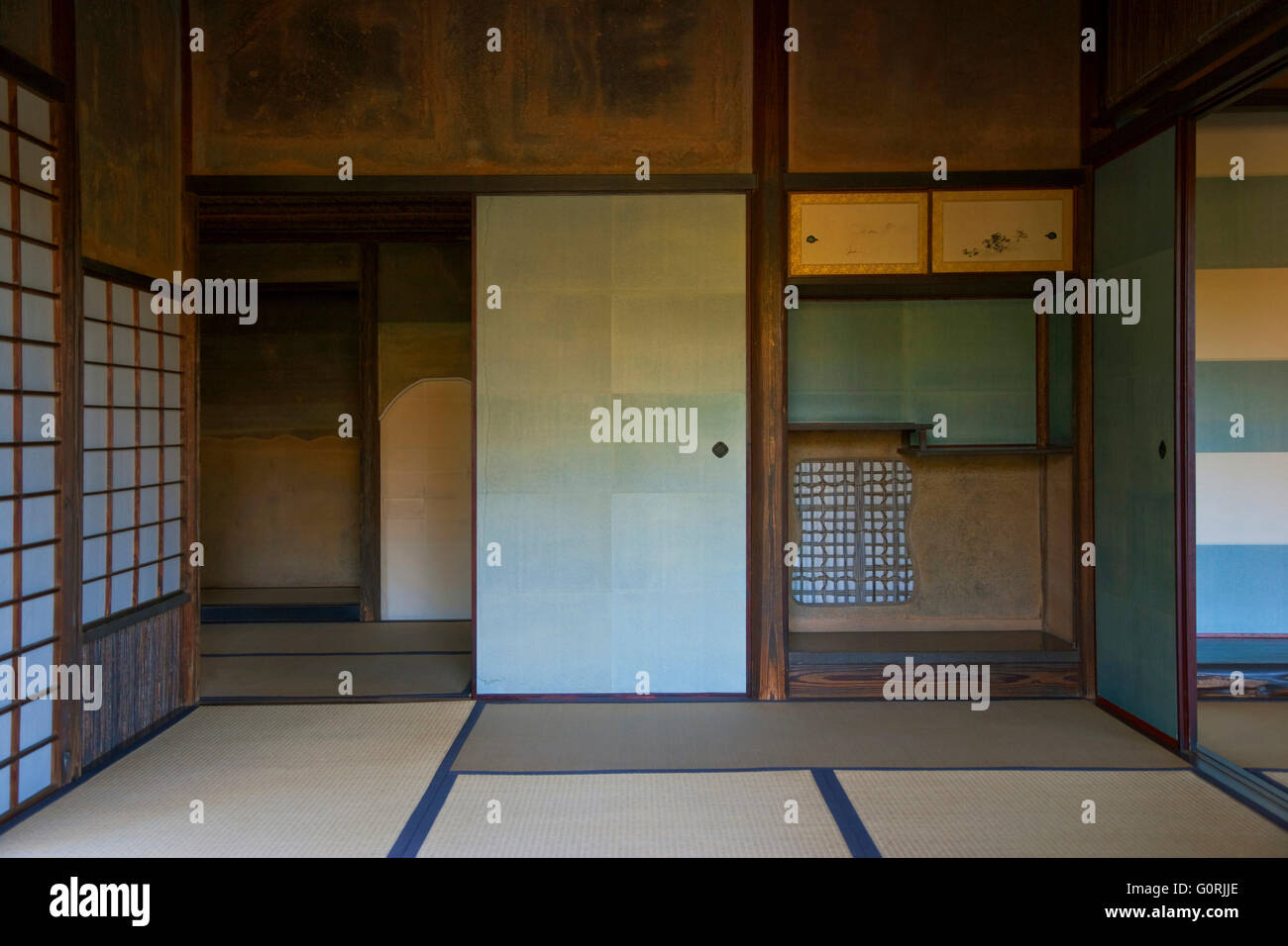 A naturally-lit interior view shows the traditional tatami mat floors and tokonoma alcove of Shokin-tei tea pavilion inside Katsura Imperial Villa, in the southwest area of Kyoto, Japan. Stock Photo