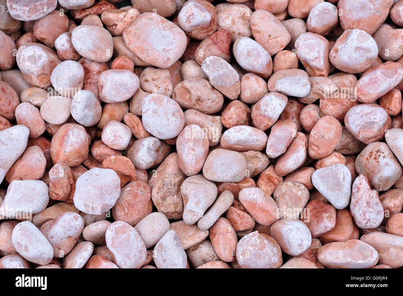 Background of small red rocks Stock Photo - Alamy