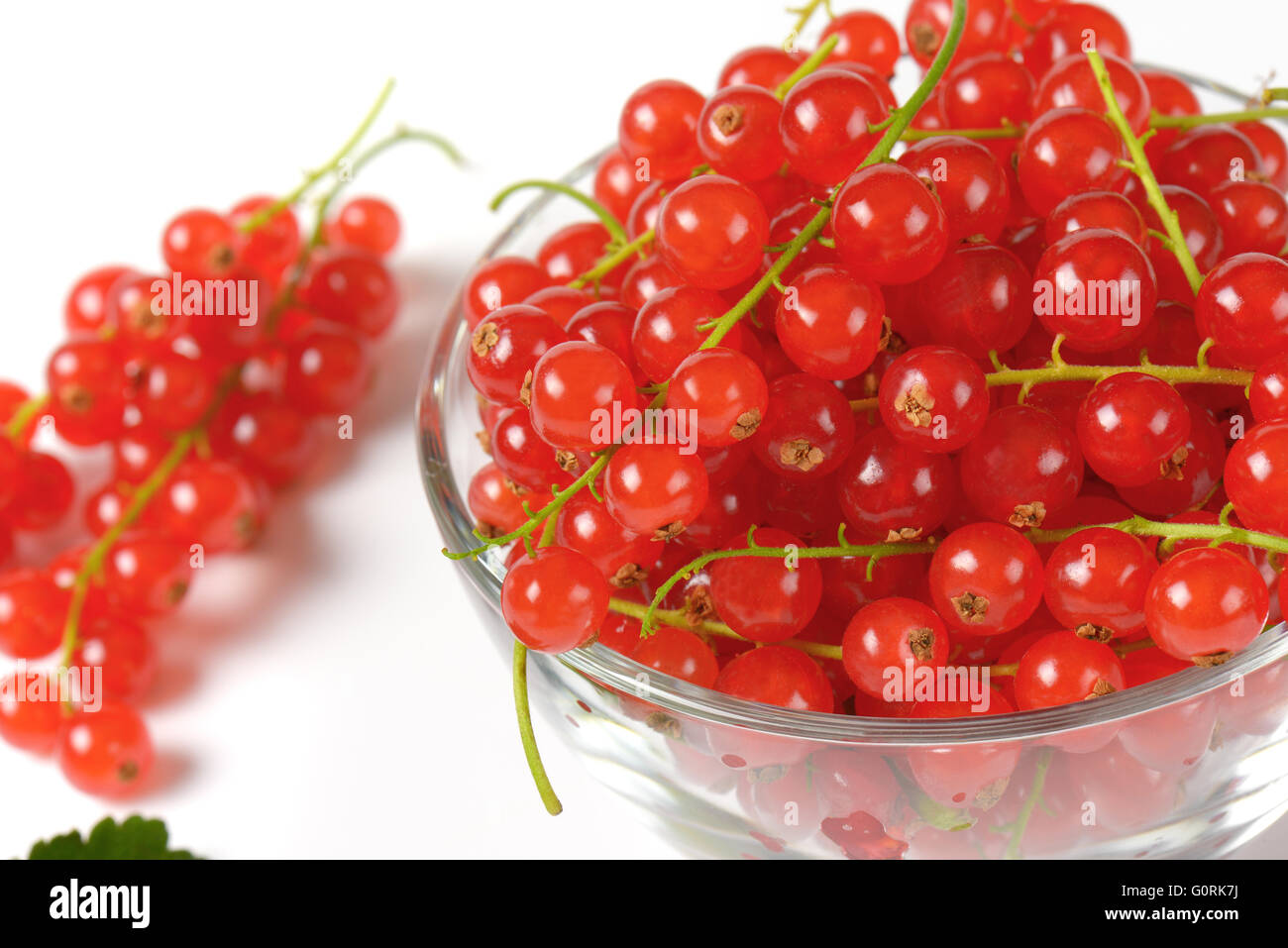 Fresh red currant berries in glass bowl Stock Photo