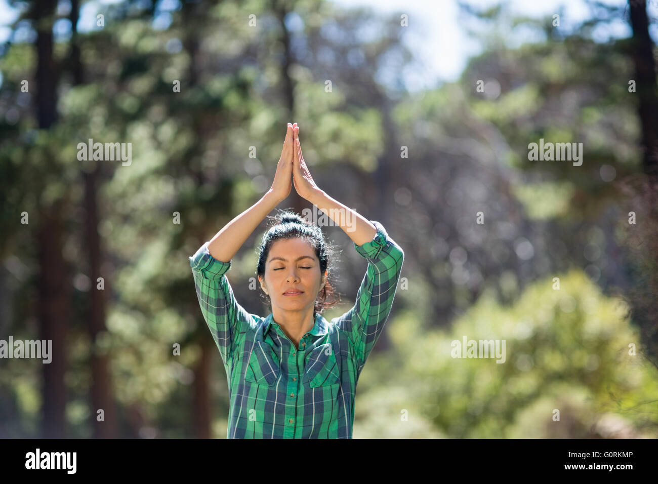 Attractive woman doing yoga Stock Photo