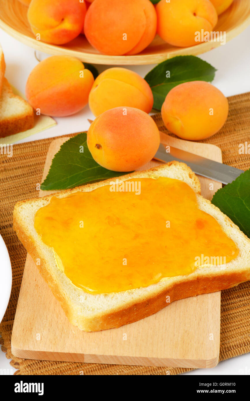 Slice of white bread with apricot jam Stock Photo Alamy