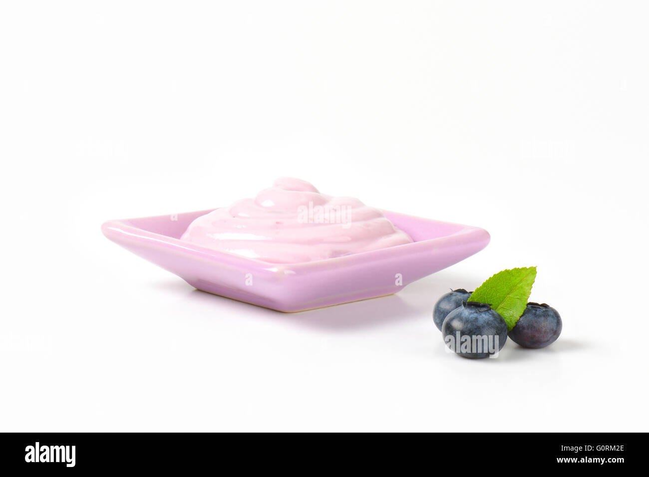 Blueberry yogurt on a small square plate Stock Photo