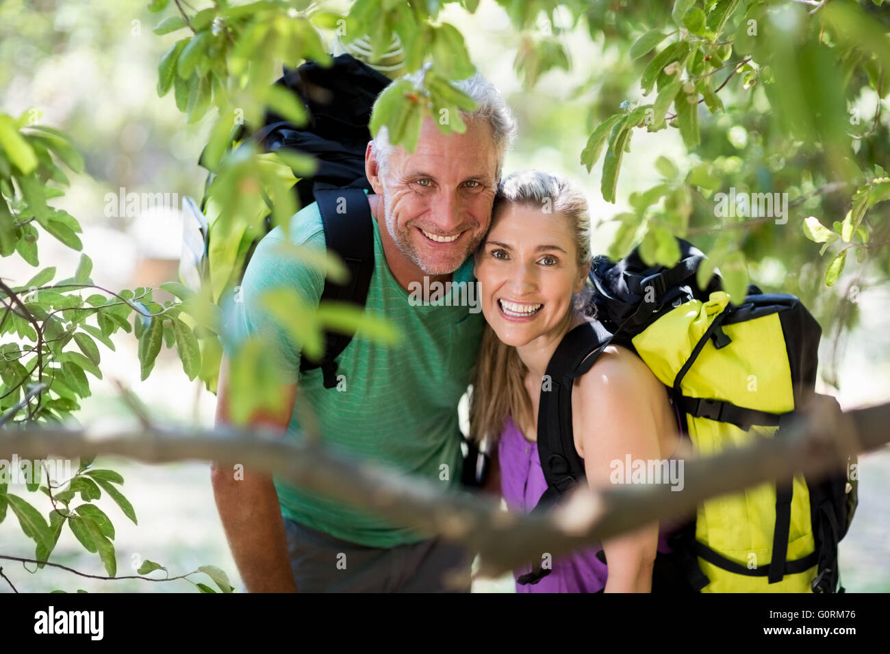 Couple smiling and posing during a hike Stock Photo