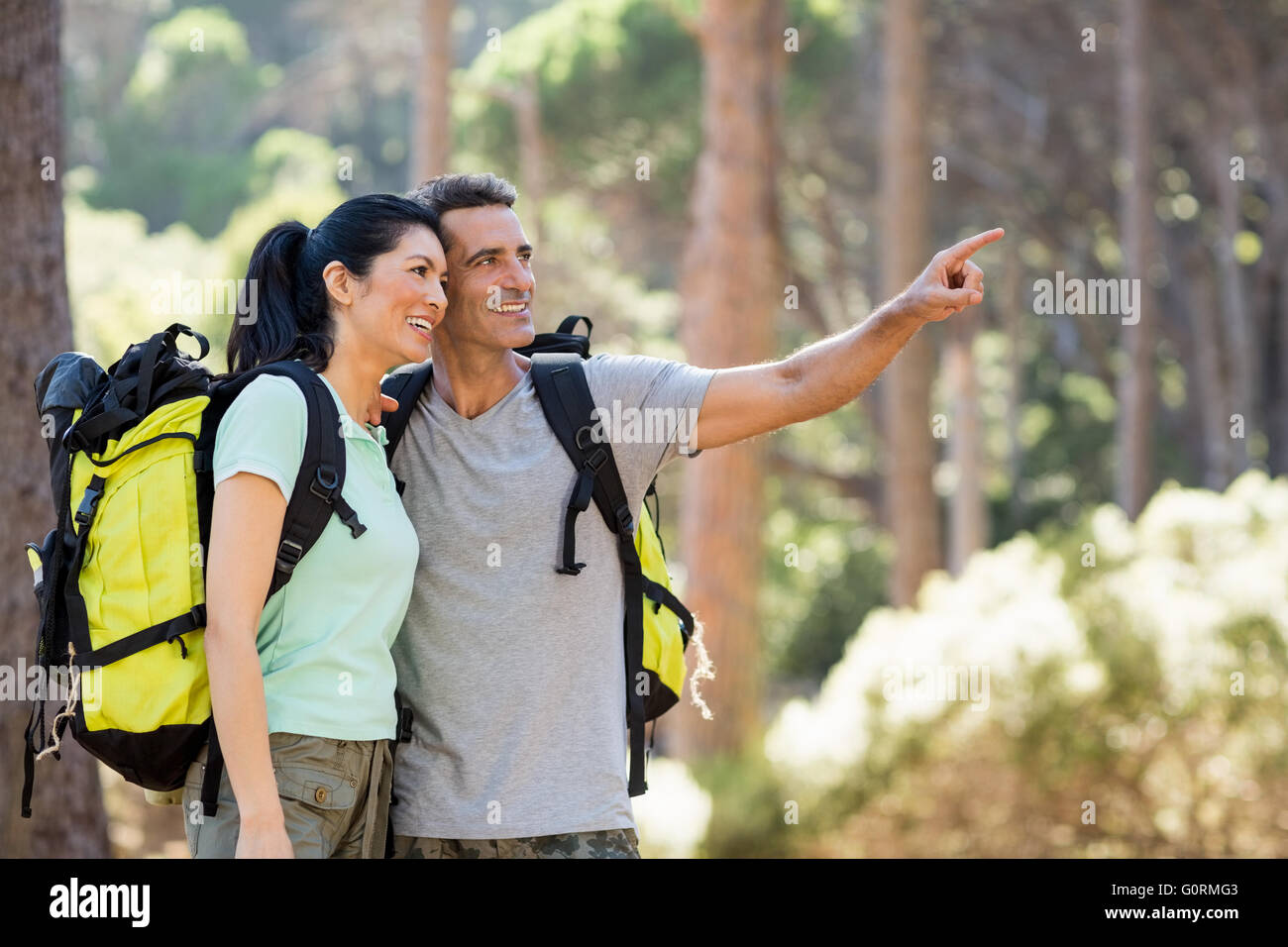 Couple pointing and hiking Stock Photo