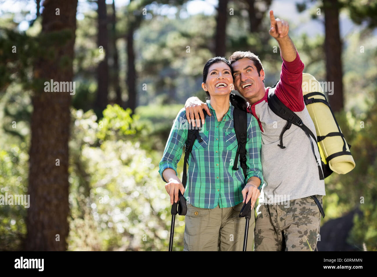 Couple pointing and hiking Stock Photo