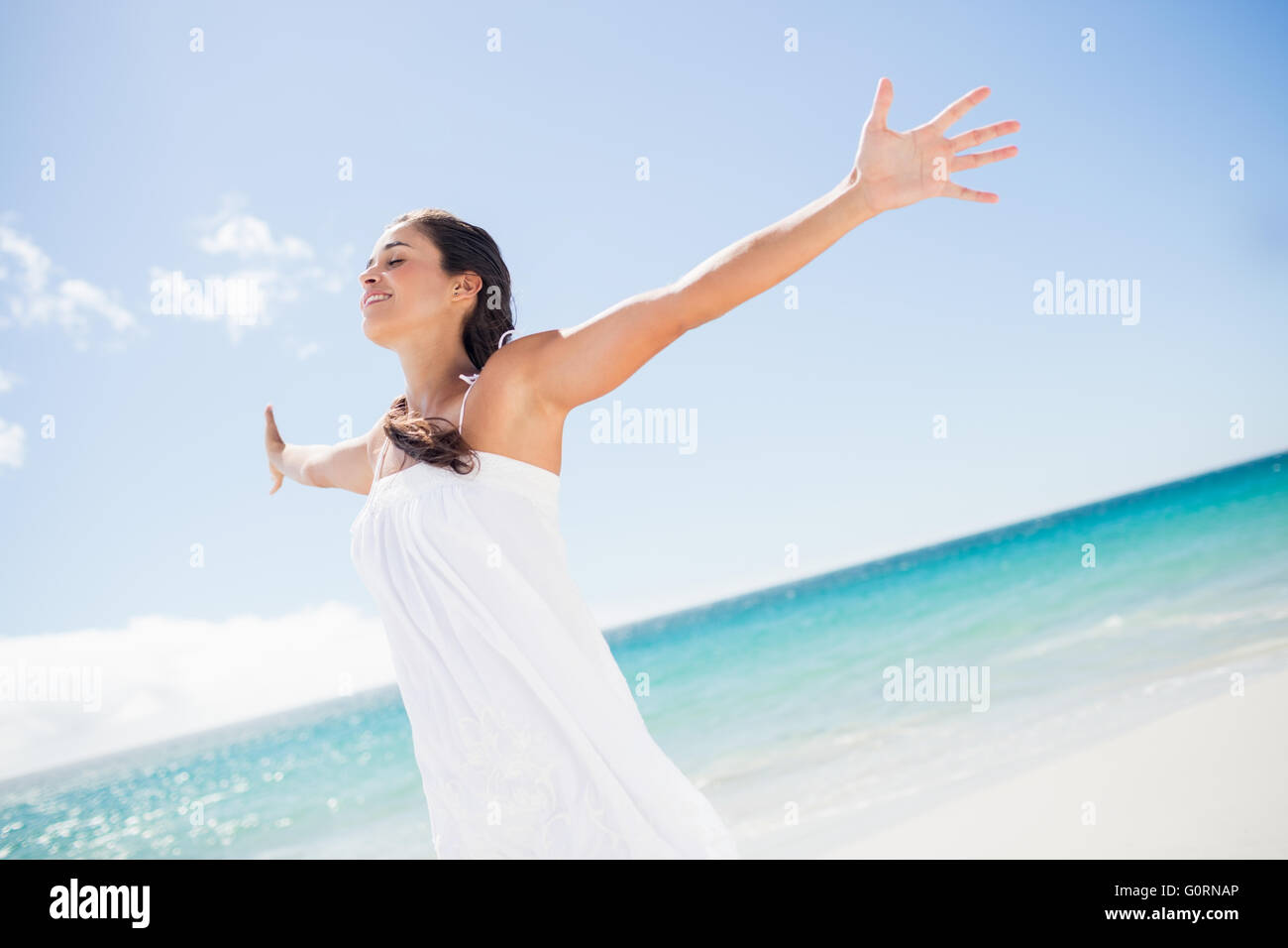 Portrait of smiling woman on the beach Stock Photo - Alamy