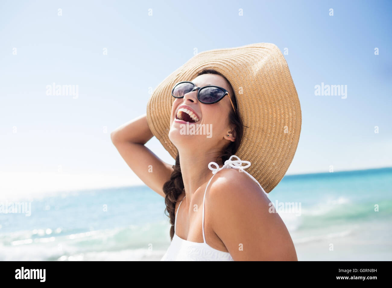 Portrait of smiling woman on the beach Stock Photo - Alamy