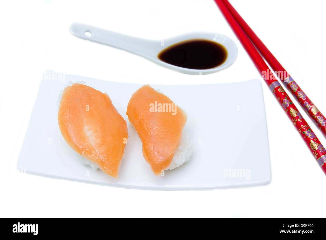Nigiri with salmon on a white background seen up close Stock Photo
