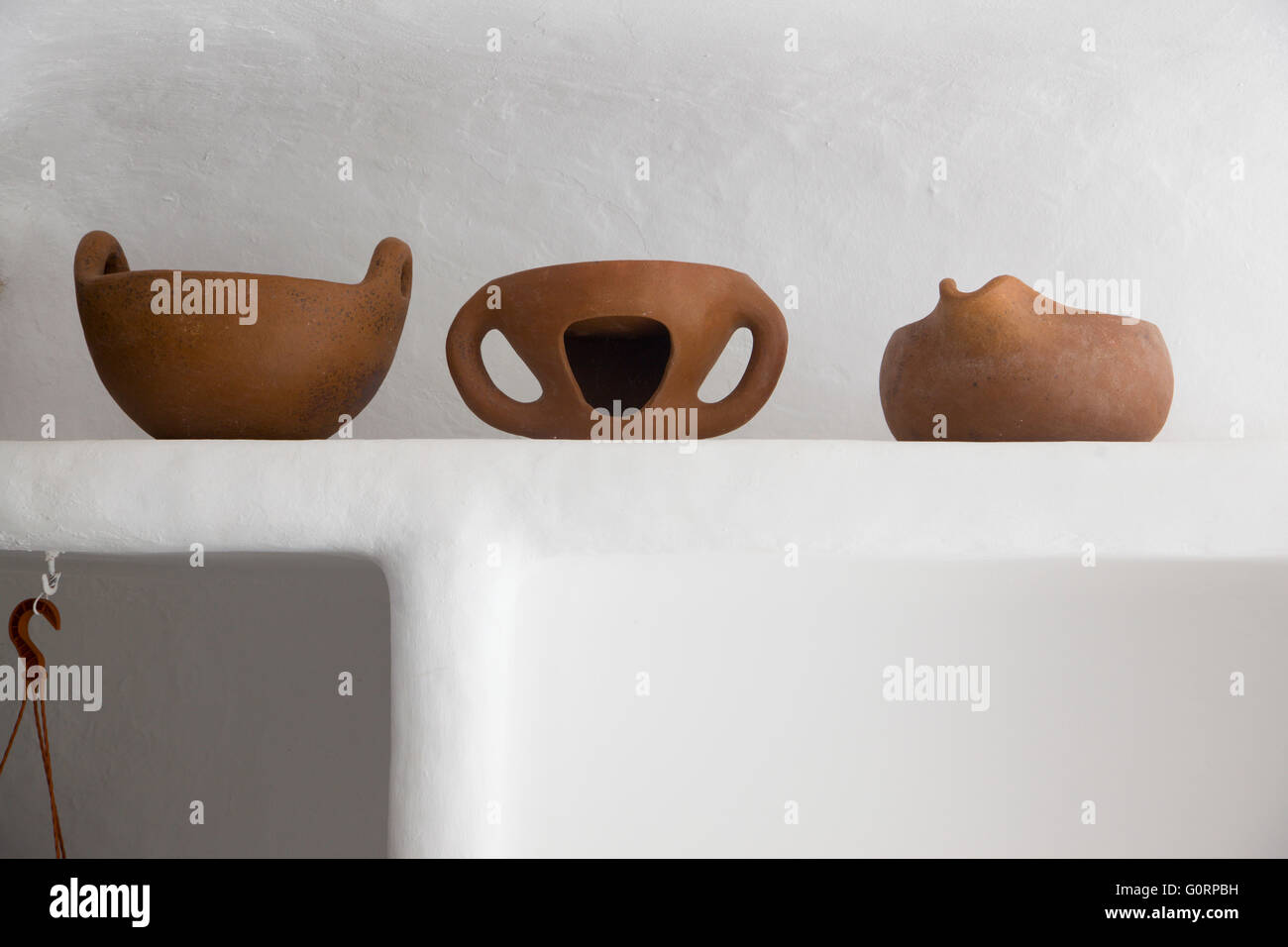 A row of Terracotta pots on a shelf in an outdoor room, Jameos del Agua, Lanzarote Stock Photo