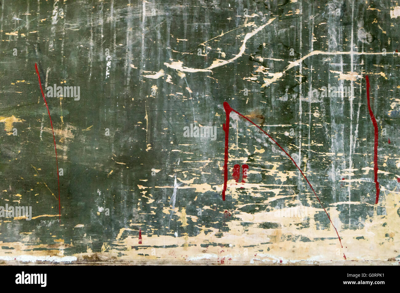 Old scratchy wooden board with colors and chalk mainly green. Abstract, odd, artistic backgrounds with unconventional outcome. Stock Photo