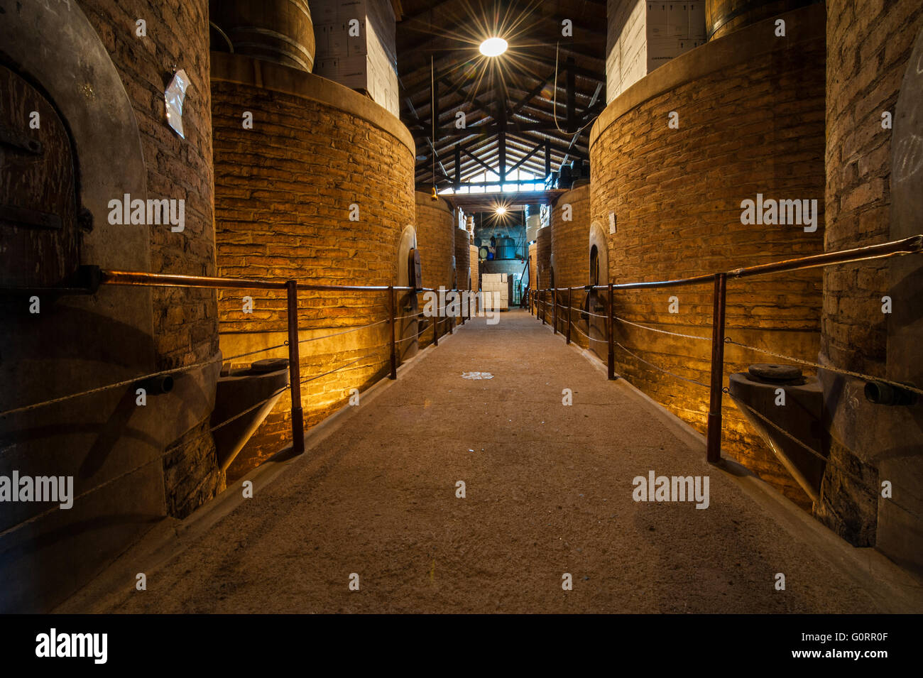 Old brick wine barrels for aging wine, took it in a winery in Mendoza, Argentina Stock Photo