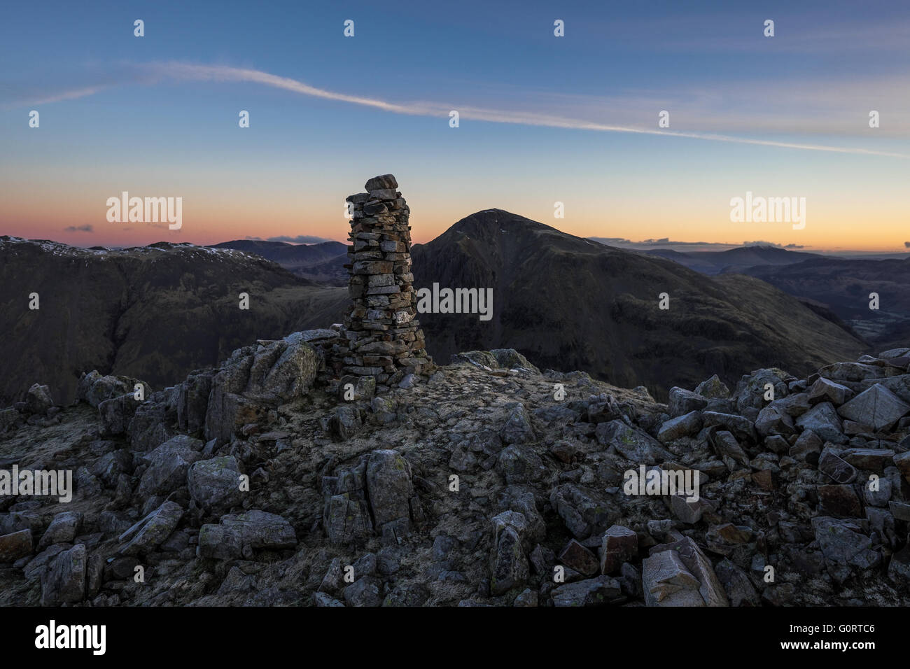 Cairn on Lingmell with Great Gable in the background, pre-dawn, English Lake District. Stock Photo