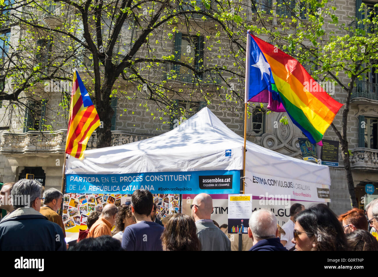 Booth of LGBT people supporting Catalan independence from Spain. Combined Catalan and Rainbow flag. Barcelona, 23 April 2016. Stock Photo