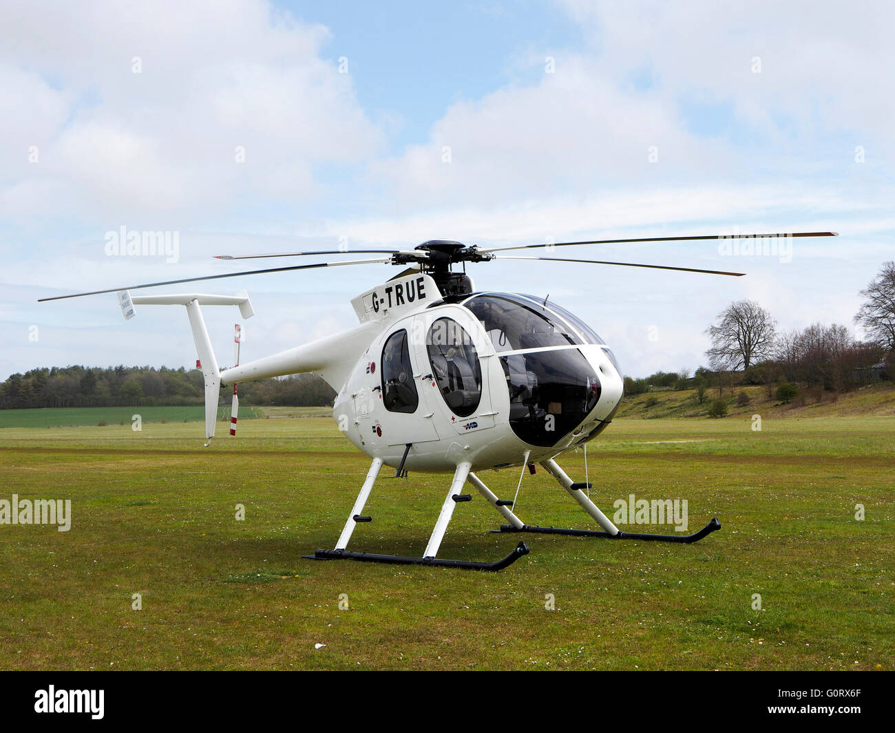 McDonnell Douglas MD-500E jet powered light utility helicopter G-TRUE on teh grounds at Popham Airfield, Hampshire Stock Photo