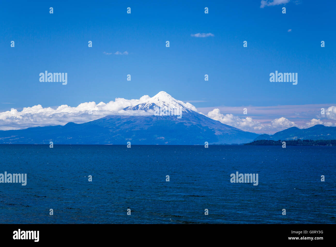 The Osorno volcano across the lake in Puerto Varas,  Llanquihue Province, Chile, South America. Stock Photo