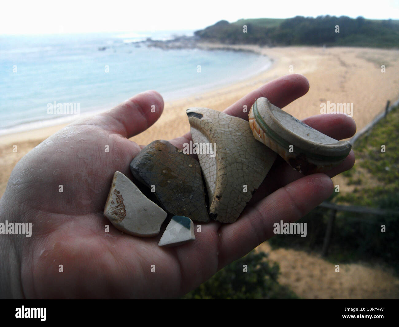 Sea pottery, broken pieces of ceramic worn by sea & sand, found on the beach at Little Bay, Sydney, NSW, Australia. No MR Stock Photo
