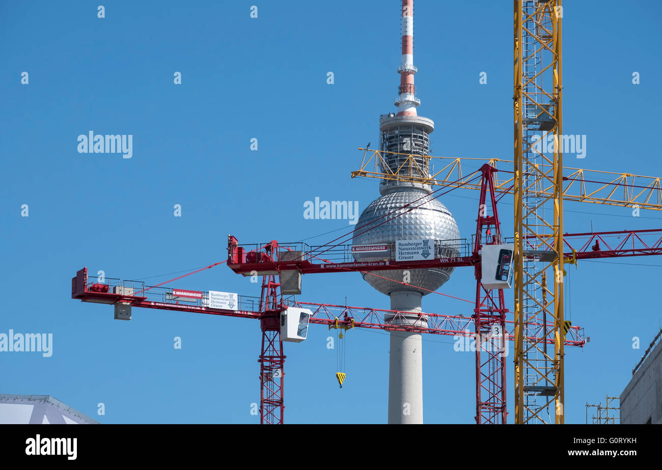 Berlin Television Tower or Fernsehturm and many construction cranes in Mitte Berlin Germany Stock Photo