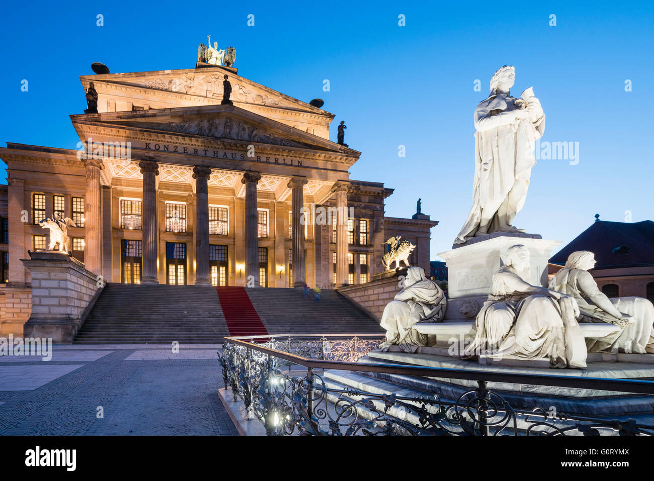 Schiller Statue and Konzerthaus in Gendarmenmarkt square in the evening in Mitte Berlin Germany Stock Photo