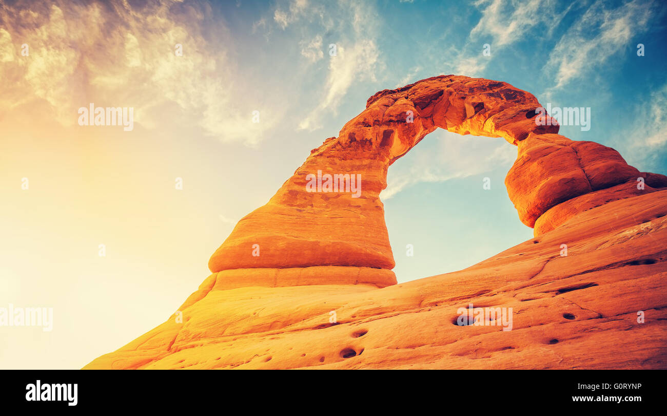 Vintage toned Delicate Arch at sunset, Arches National Park in Utah, USA. Stock Photo