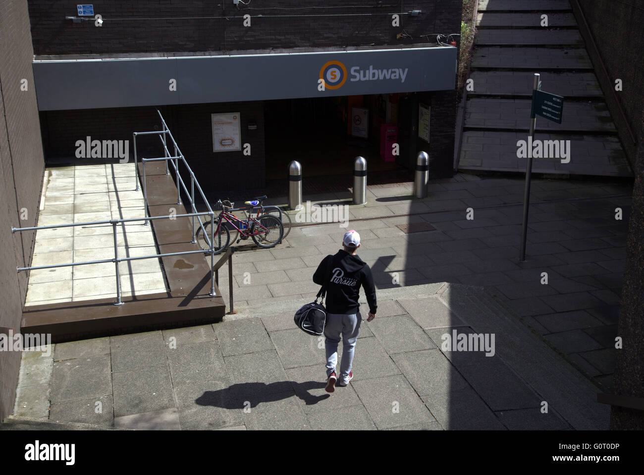 George Cross Subway entrance with young person entering, Glasgow U.K Stock Photo
