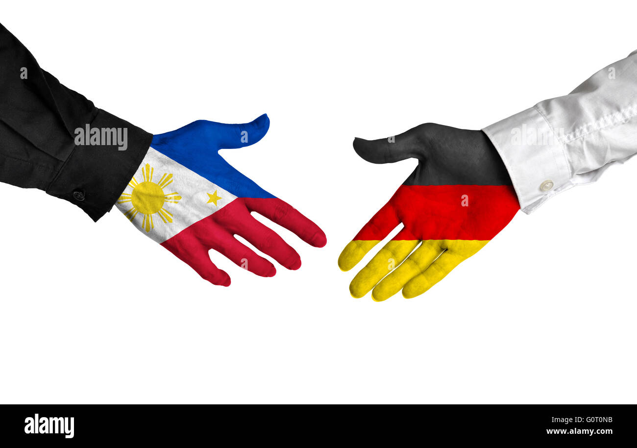 Philippines and Germany leaders shaking hands on a deal agreement Stock Photo