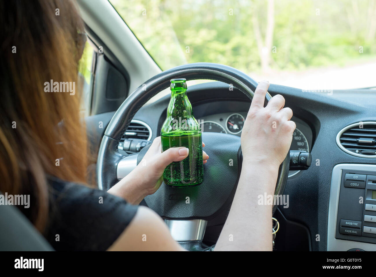 picture of woman drinking alcohol in the car Stock Photo Alamy