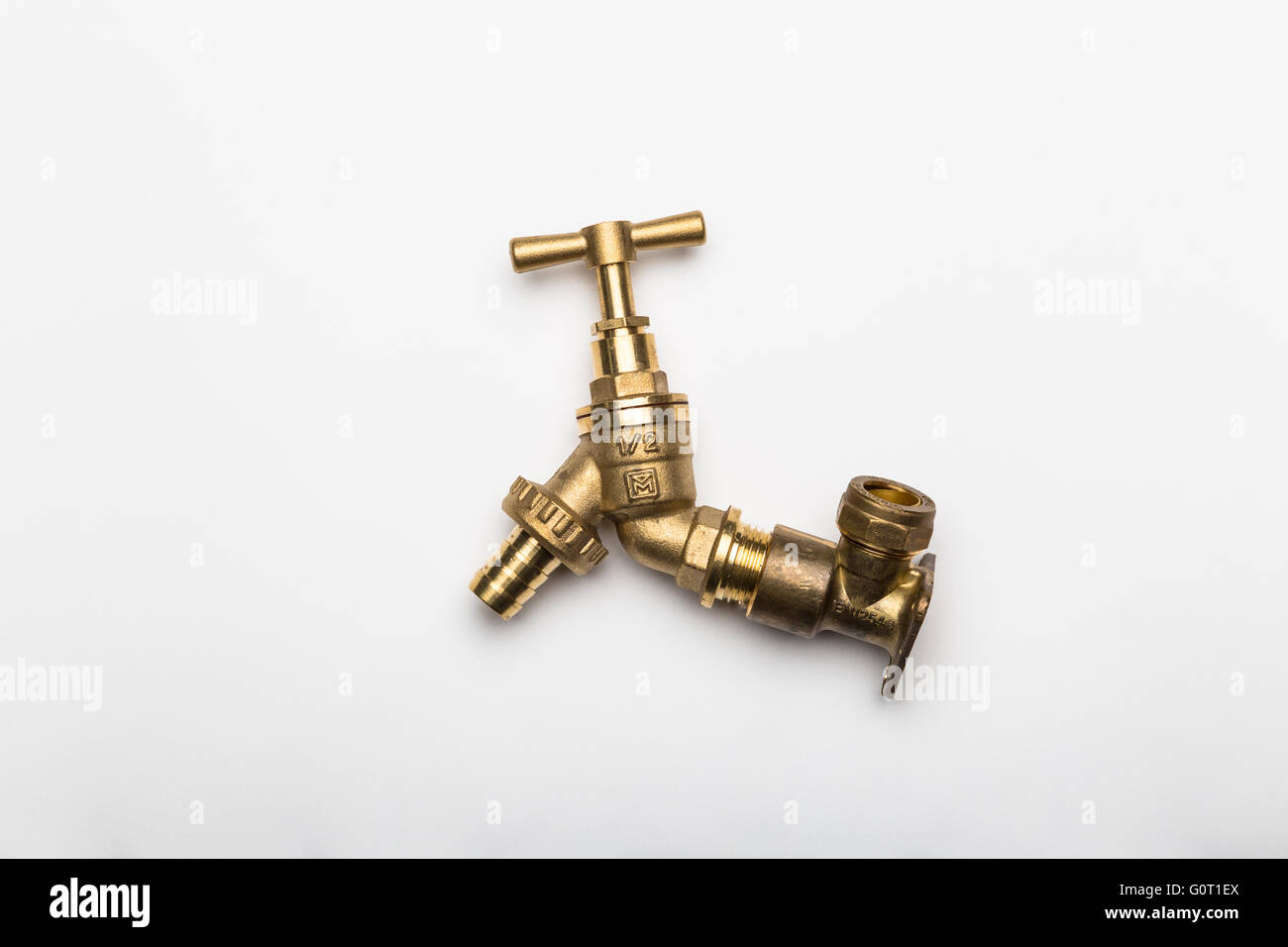 Shiny, new brass tap (faucet), on white background. Stock Photo