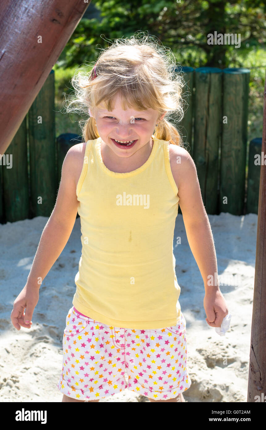 lovely smiling girl in the playground Stock Photo - Alamy