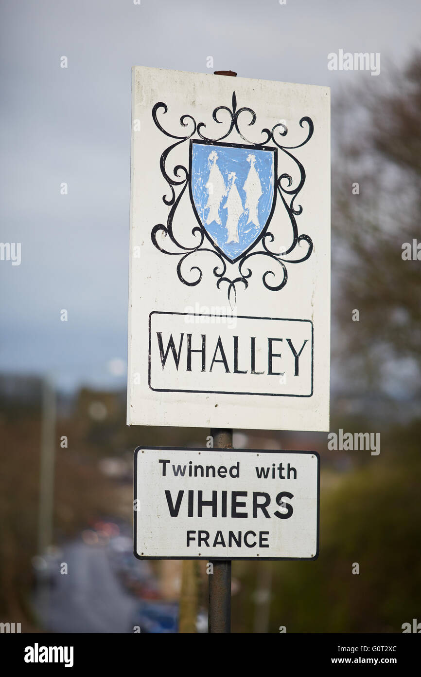 Whalley a large village in Ribble Valley on the banks of the River Calder in Lancashire.  coat of arms sign at the foot off the Stock Photo